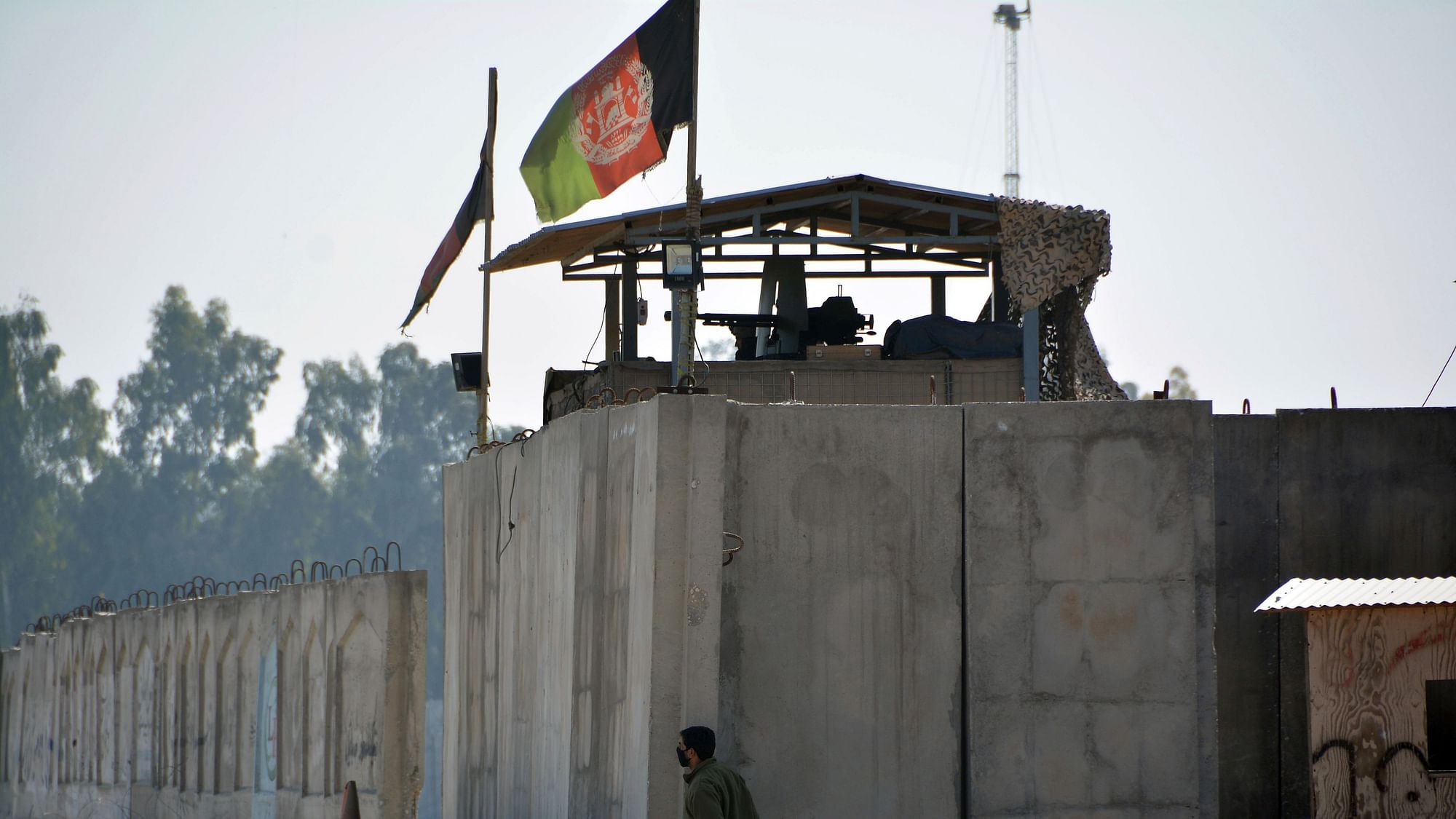 An Afghan security personnel stands guard in the checkpoint of an airport after a suicide attack in Jalalabad province, east of Kabul, Afghanistan, Wednesday, 6 March, 2019.