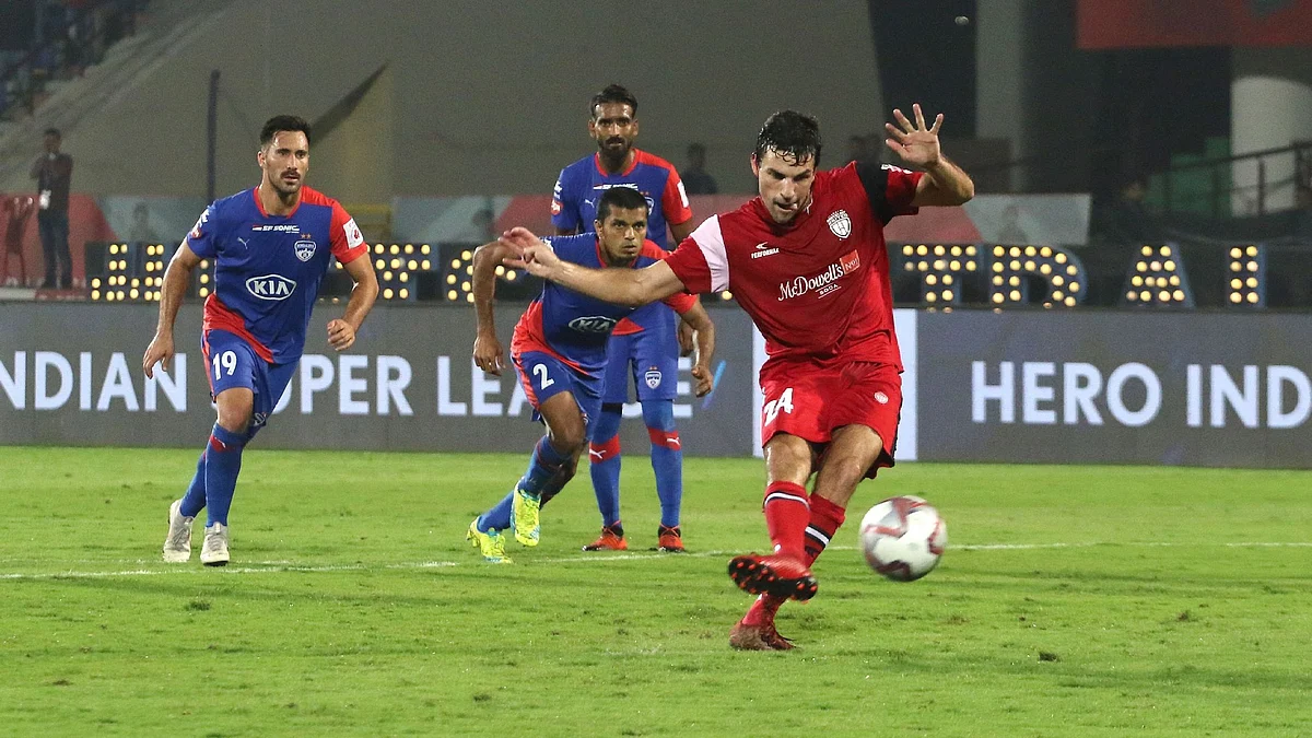 Juan Mascia of NorthEast United FC converts penalty during stoppage time to score the winning goal against Bengaluru FC on Thursday.