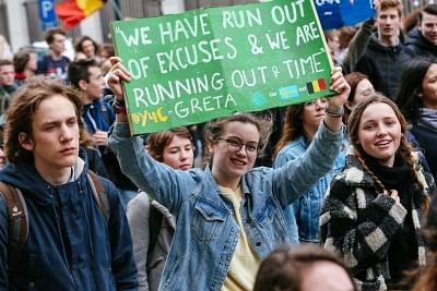 BRUSSELS, Feb. 28, 2019 (Xinhua) -- Students hold placards as they attend a climate march in Brussels, Belgium, on Feb. 28, 2019. A new climate march by schoolchildren and college students was organized across Belgium on Thursday with the participation of Swedish teen climate activist Greta Thunberg. (Xinhua/Zhang Cheng/IANS)