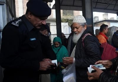 LAHORE, March 5, 2019 (Xinhua) A policeman checks documents of a passenger traveling with the Samjhota Express at a railway station in eastern Pakistan