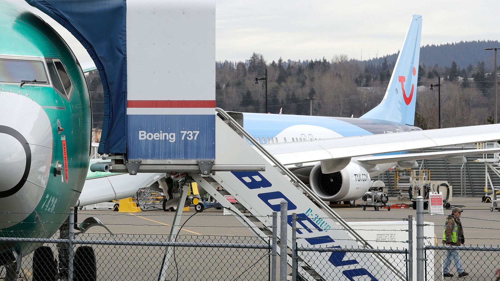 In this file photo, a Boeing 737 MAX 8 airplane sits parked in the background.&nbsp;