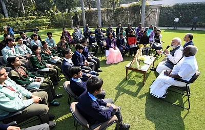 New Delhi: Prime Minister Narendra Modi interacts with visually impaired children during the release of new series of visually impaired friendly circulation coins, in New Delhi, on March 7, 2019. Also seen Union Finance Minister Arun Jaitley and Union MoS Finance P. Radhakrishnan. (Photo: IANS/PIB)