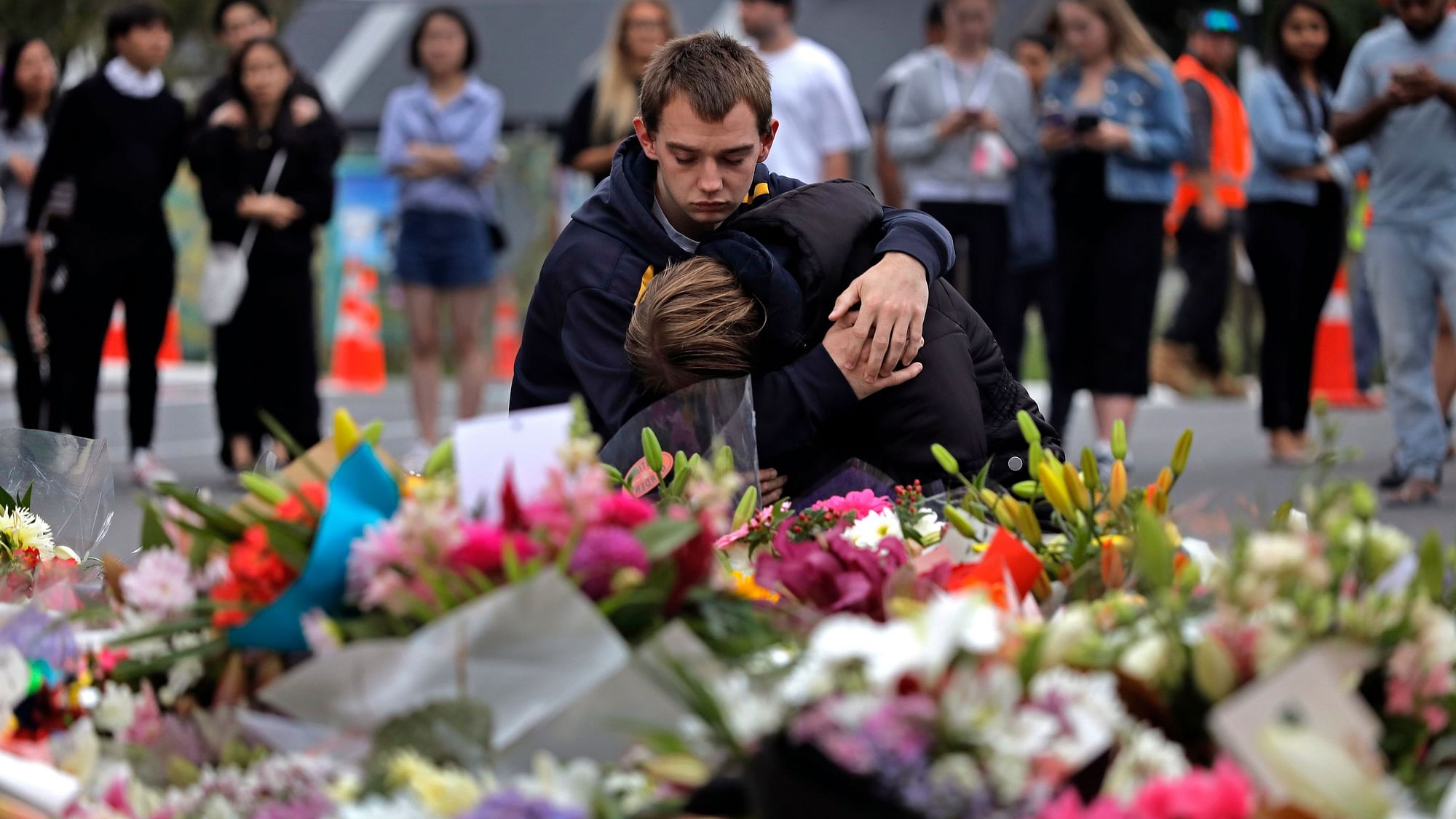 Mourners pay their respects at a makeshift memorial near the Masjid Al Noor mosque in Christchurch, New Zealand.