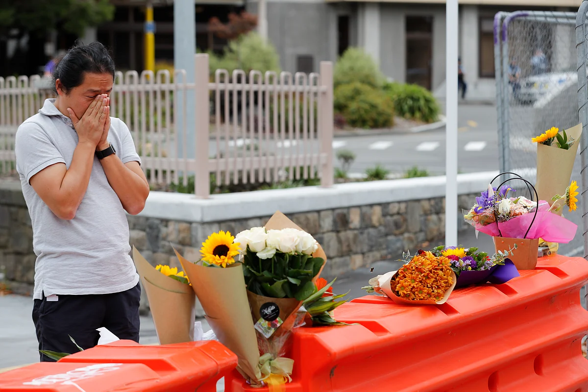 Mourner pay their respects at a makeshift memorial outside Christchurch hospital in Christchurch, New Zealand, Saturday, 16 March 2019, one day after the mass shootings at two mosques in the city.