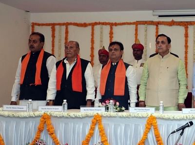 Ahmaedabad: Gujarat chief minister Vijay Rupani with Jawahar Chavda, Yogesh Patel and Dharmendrasinh Jadeja who were inducted into as ministers in his government in Ahmaedabad, on March 9, 2019. (Photo: IANS)