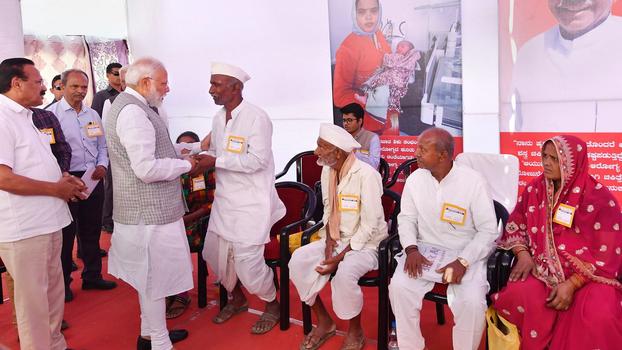 Prime Minister Narendra Modi interacts with beneficiaries of Ayushman Bharat Yojna, in Kalaburagi, Karnataka.