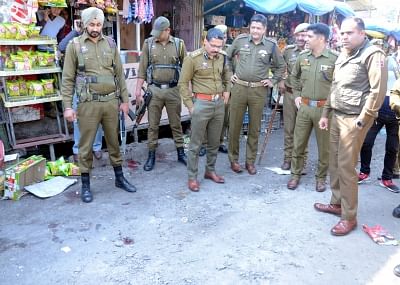 Jammu: Security personnel carry out investigations at the site where at least one person was killed and 30 others were injured when a grenade flung under a parked bus by a militant exploded at Jammu