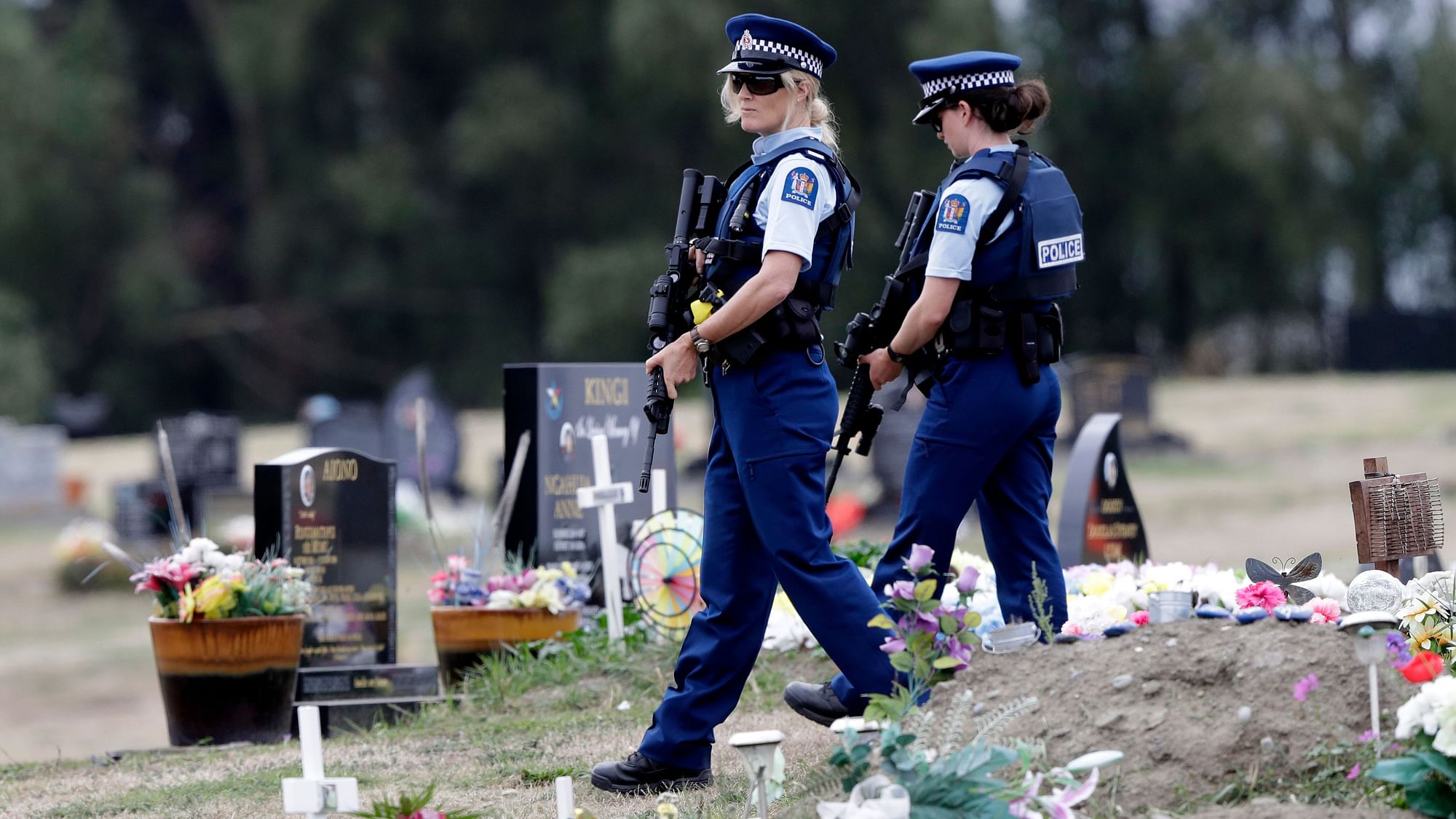 Police personnel stand guard at a memorial site for the victims of Christchurch terror attack.