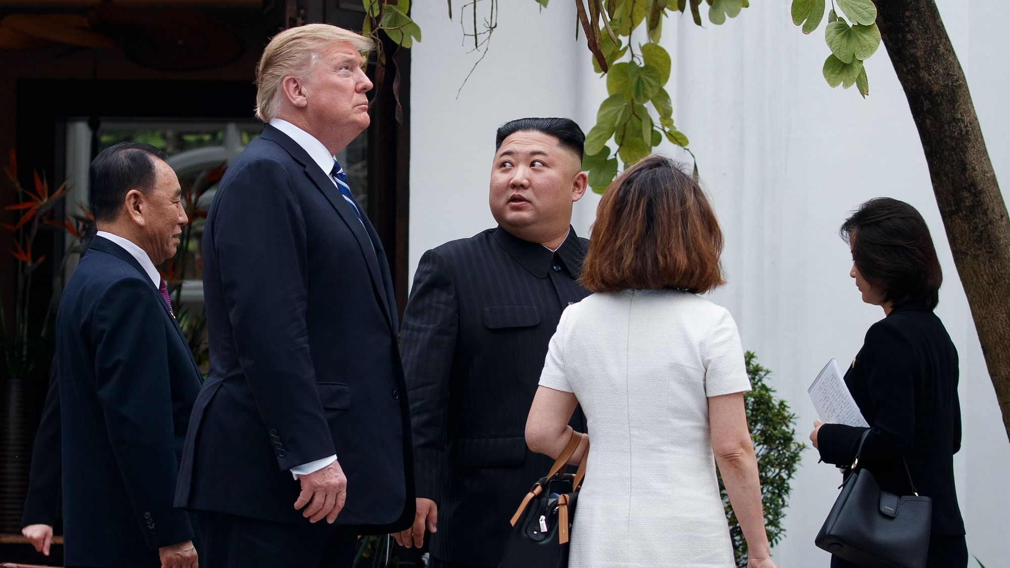 President Donald Trump and North Korean leader Kim Jong-un take a walk after their meeting in Hanoi, Vietnam.