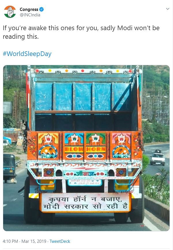 The image of the truck has been photshopped to add a signboard that is critical of the Modi government.