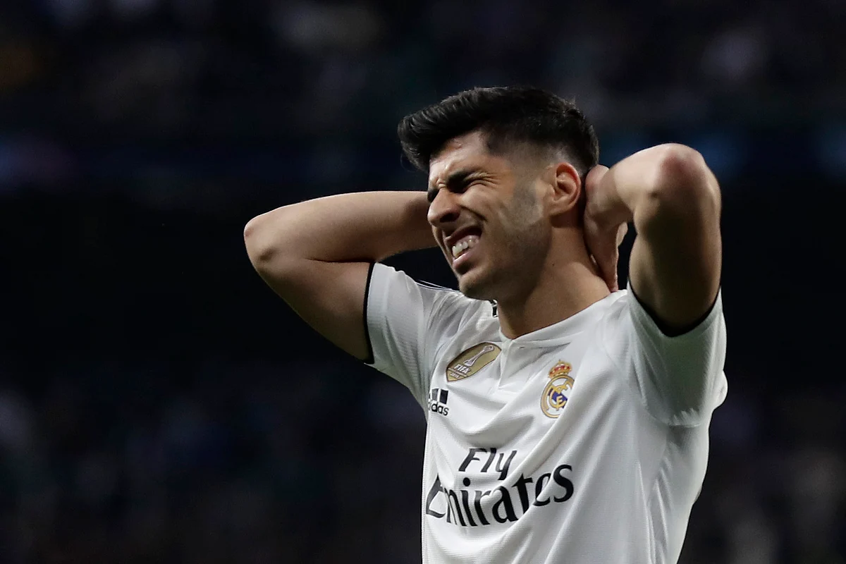 Real midfielder Marco Asensio reacts during the Champions League soccer match between Real Madrid and Ajax at the Santiago Bernabeu stadium in Madrid, Spain, Tuesday, March 5, 2019. 