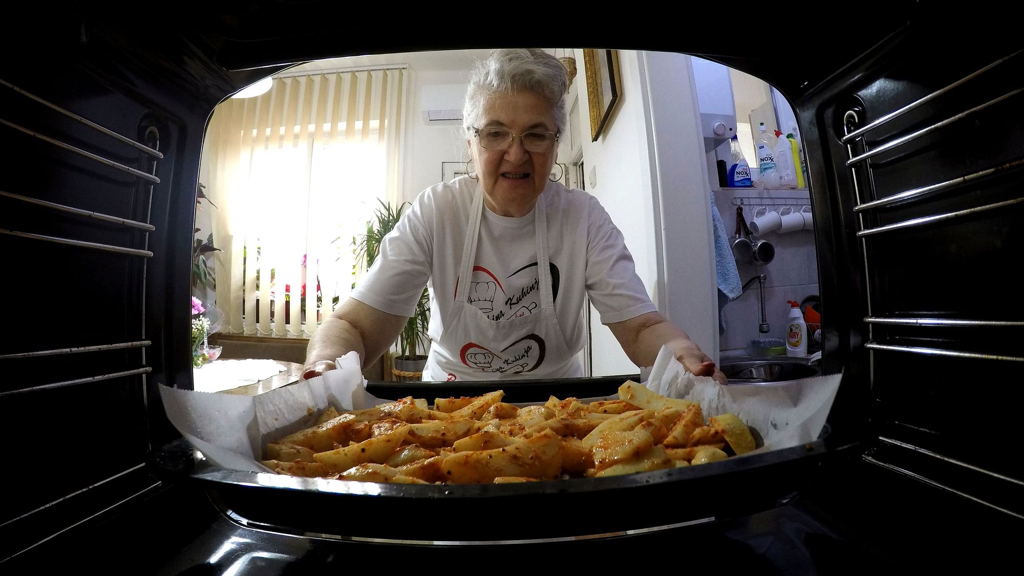 Granny Jelena Petrovic preparing a recipe.