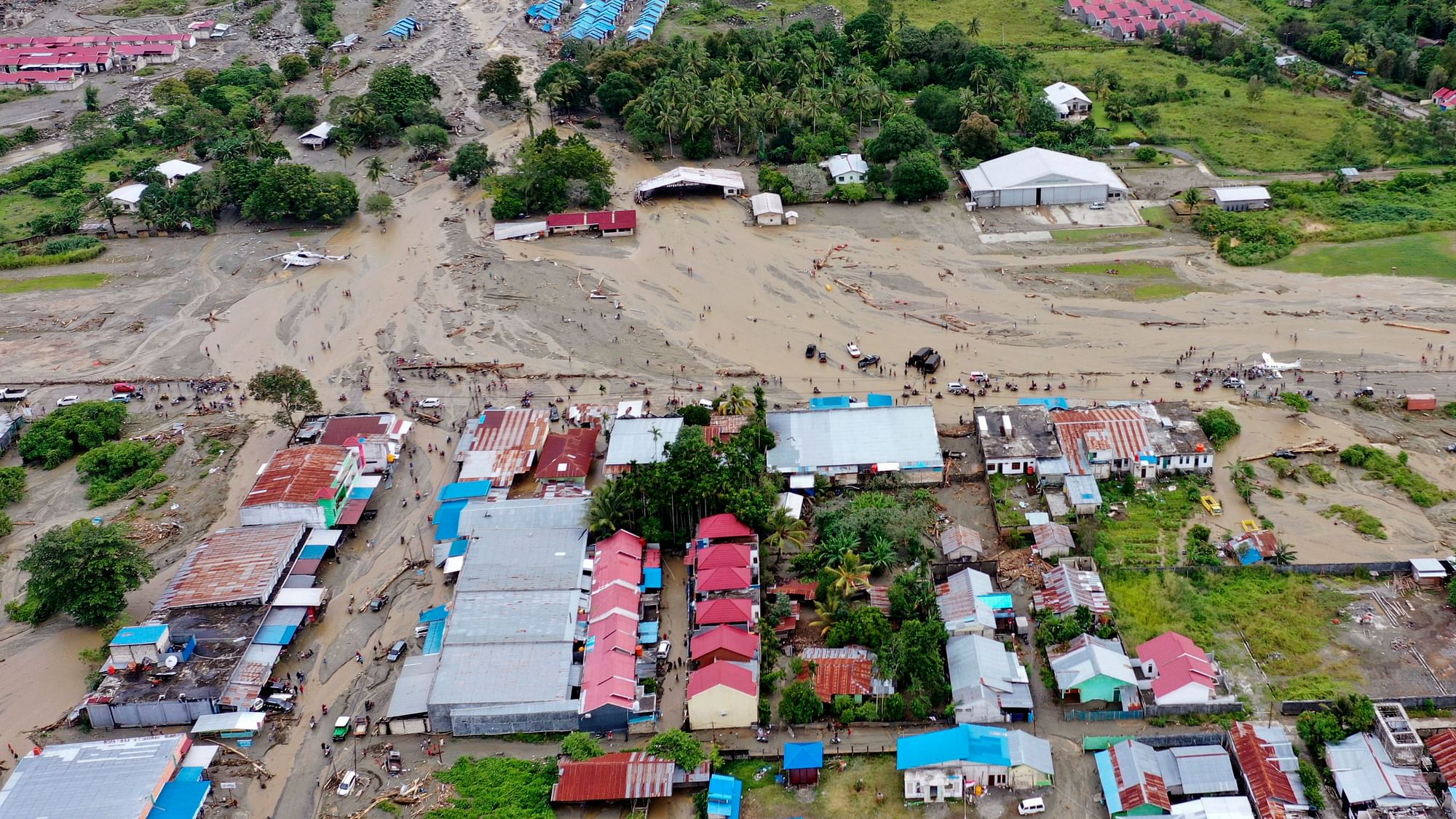 This aerial shot taken on Sunday, 17 March, 2019 shows the area affected by flash floods in Sentani, Papua province, Indonesia. Flash floods and mudslides triggered by downpours tore through mountainside villages in Indonesia’s easternmost province, killing dozens of people, disaster officials said.