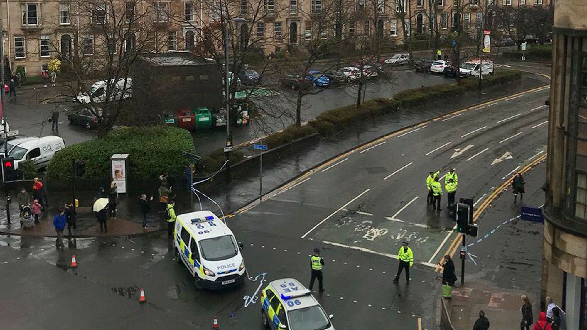 The scene as police secure the area outside the University of Glasgow, Scotland, after a suspicious package was found at the university.