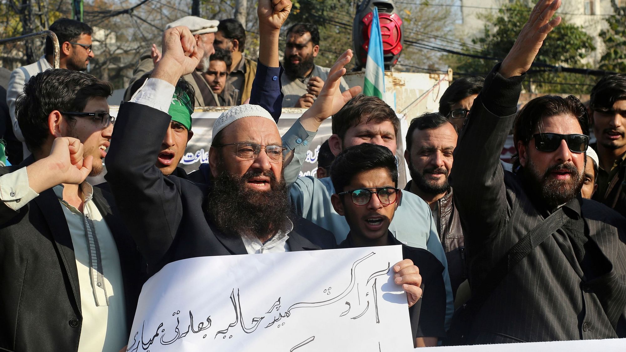 Supporters of Jamaat-e-Islami attend anti-India rally, with one holding a poster that reads, “we condemn the Indian attack,” in Lahore on 26 Feb 2019. Image used for representational purposes.
