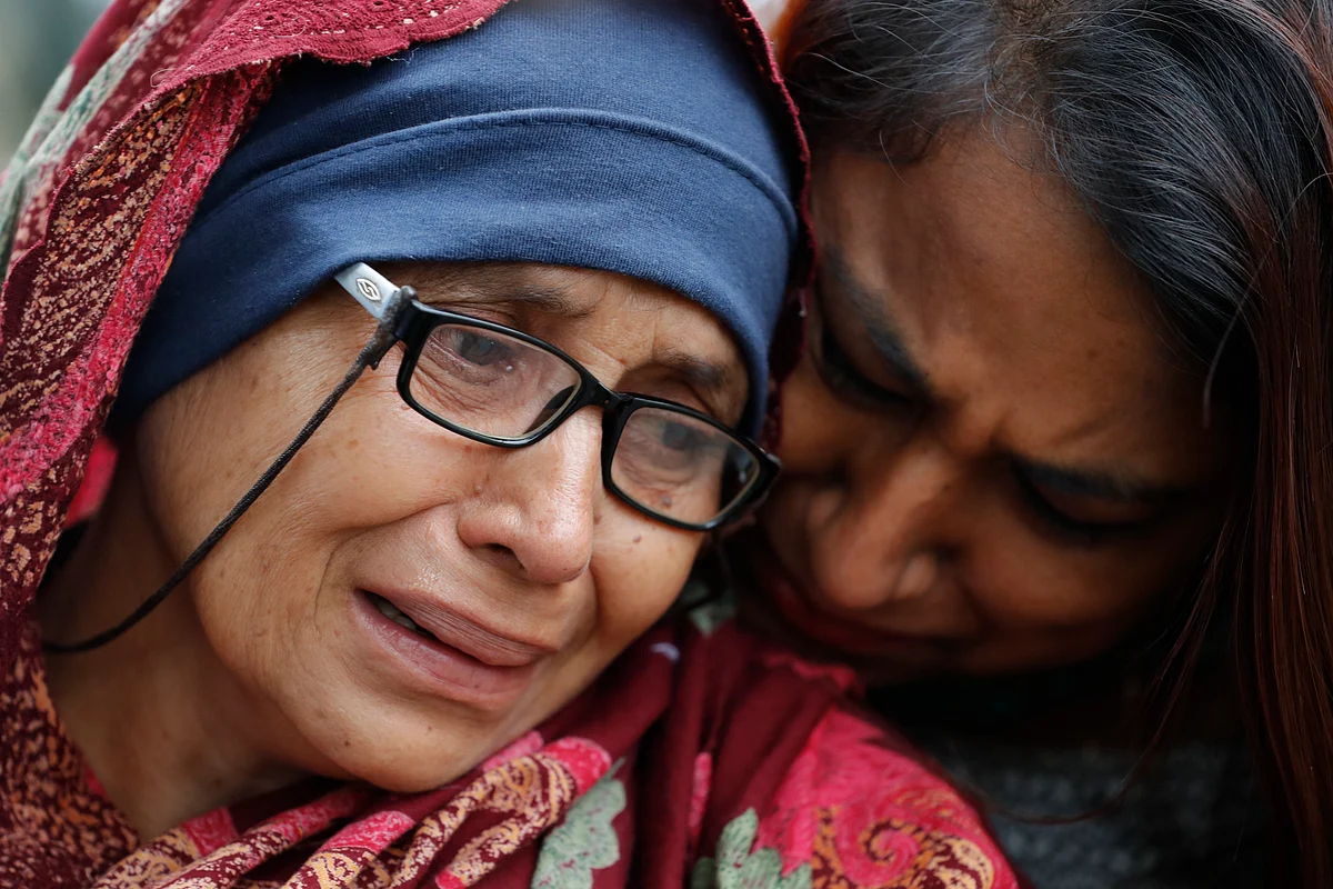A woman who lost her husband during Friday’s mass shootings cries outside an information center for families, Saturday, 16 March 2019, in Christchurch, New Zealand. The white supremacist gunman appeared in court Saturday charged with murder in the mosque assaults that killed at least 49 people and led to the prime minister to call for a tightening of national gun laws.
