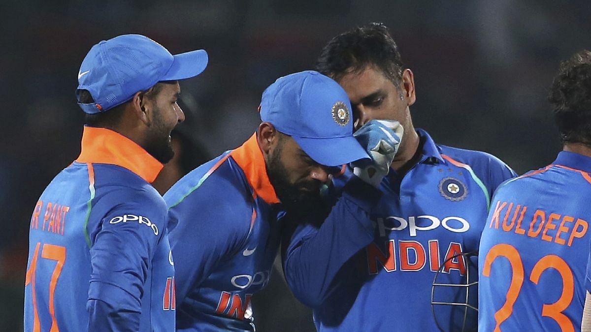 File picture of MS Dhoni and Virat Kohli in discussion during India’s ODI series against West Indies in October 2018.
