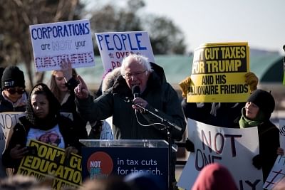 WASHINGTON, Dec. 13, 2017 (Xinhua) -- U.S. Senator Bernie Sanders (front) speaks during a rally against the Republican tax plan on Capitol Hill in Washington D.C., the United States, on Dec. 13, 2017. (Xinhua/Ting Shen/IANS)