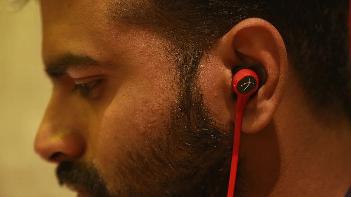The HyperX Cloud Earbuds with a multi-function button.