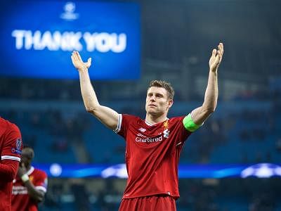 Milner's penalty puts Liverpool in EPL's top spot