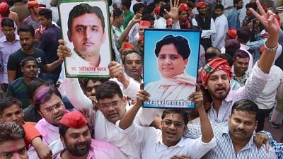 Lucknow: Samajwadi Party (SP) and Bahujan Samaj Party (BSP) workers celebrate, outside SP office in Lucknow on March 14, 2018. SP on Wednesday took winning leads in both the Lok Sabha seats of Gorakhpur and Phulpur. With BSP backing its bitter rival SP, BJP appeared to be heading for a shock defeat. (Photo: IANS)