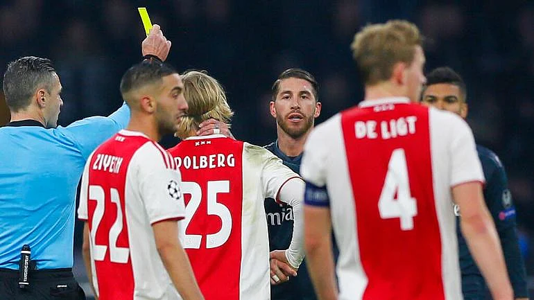 Captain Sergio Ramos receives a yellow card during the first leg of the Real Madrid-Ajax tie – a ‘mistake’ he, and the club, would come to rue.