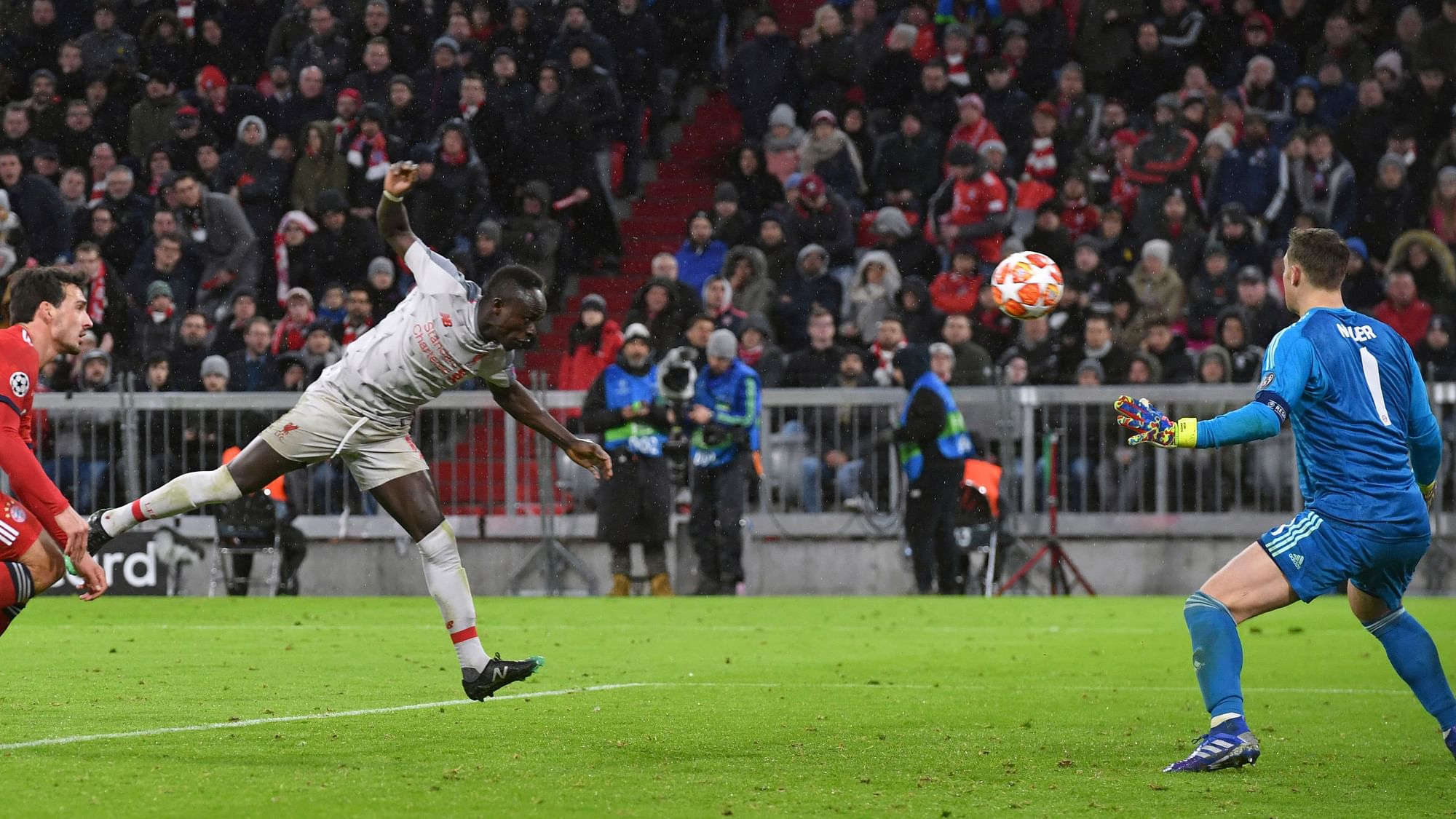 Liverpool midfielder Sadio Mane, second left, scores his side’s third goal during the Champions League round of 16 second leg match between Bayern Munich and Liverpool at the Allianz Arena, in Munich.tin Joensson)