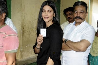 Chennai: Actor Kamal Haasan with her daughter-actress Shruti Haasan wait in a queue to cast vote during the second phase of the 2019 Lok Sabha polls, in Chennai, on April 18, 2019. (Photo: IANS)