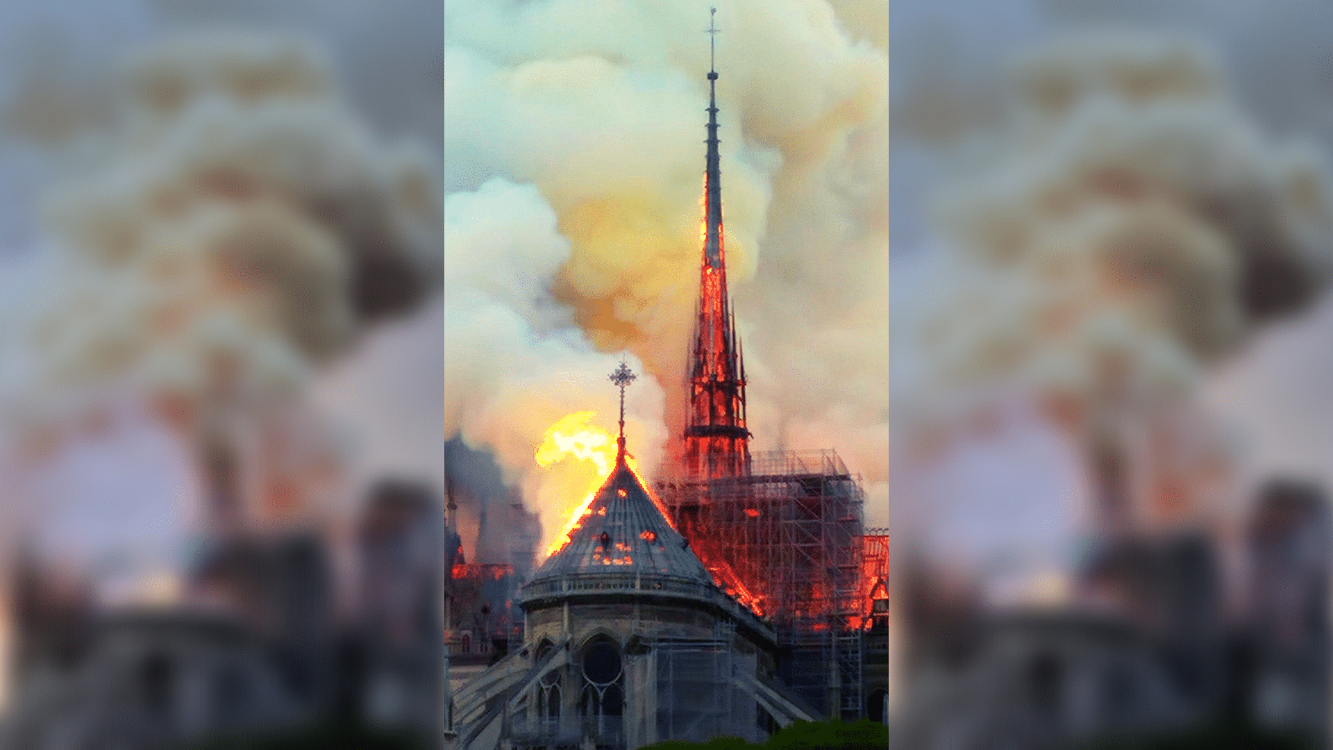 Flames and smoke rise as the spire on Notre Dame cathedral collapses in Paris, Monday, 15 April. Massive plumes of yellow brown smoke is filling the air above Notre Dame Cathedral and ash is falling on tourists and others around the island that marks the center of Paris.