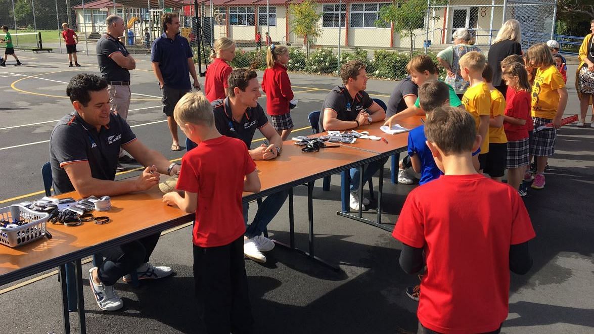 New Zealand cricketers sign autographs at Tai Tapu Primary School in Christchurch, where the team was announced.