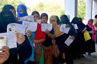 Mathura: Muslim women stand in queue to cast vote during the second phase of Lok Sabha polls, in Mathura, on April 18, 2019. (Photo: IANS)