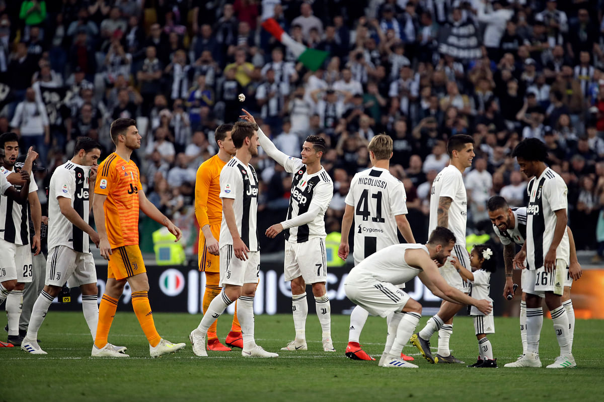 Juventus won a record-extending eighth straight Serie A title, with 5 matches to spare, after it beat Fiorentina 2-1