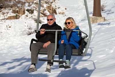 GOLAN HEIGHTS, April 23, 2019 (Xinhua) -- Israeli Prime Minister Benjamin Netanyahu (L) and his wife Sarah Netanyahu are seen on a chairlift at the Hermon resort on the Golan Heights, on April 23, 2019. Israeli Prime Minister Benjamin Netanyahu said on Tuesday that he will name a new community in the Golan Heights after U.S. President Donald Trump, who recognized Israel