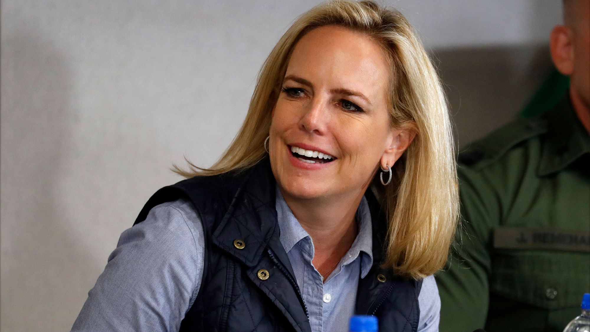 Homeland Security Secretary Kirstjen Nielsen listens to President Donald Trump at a roundtable on immigration and border security at the U.S. Border Patrol Calexico Station in Calexico.