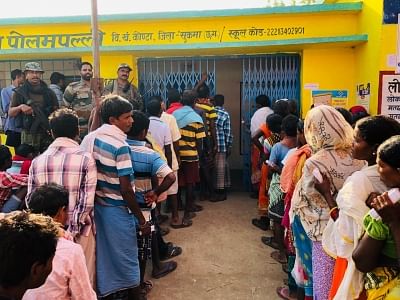 Bastar: People wait in a queue to cast their votes for the first phase of 2019 Lok Sabha elections, at a polling booth in Chhattisgarh