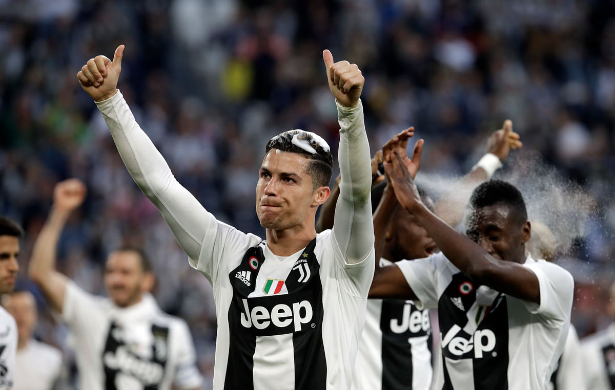 Juventus won a record-extending eighth straight Serie A title, with 5 matches to spare, after it beat Fiorentina 2-1