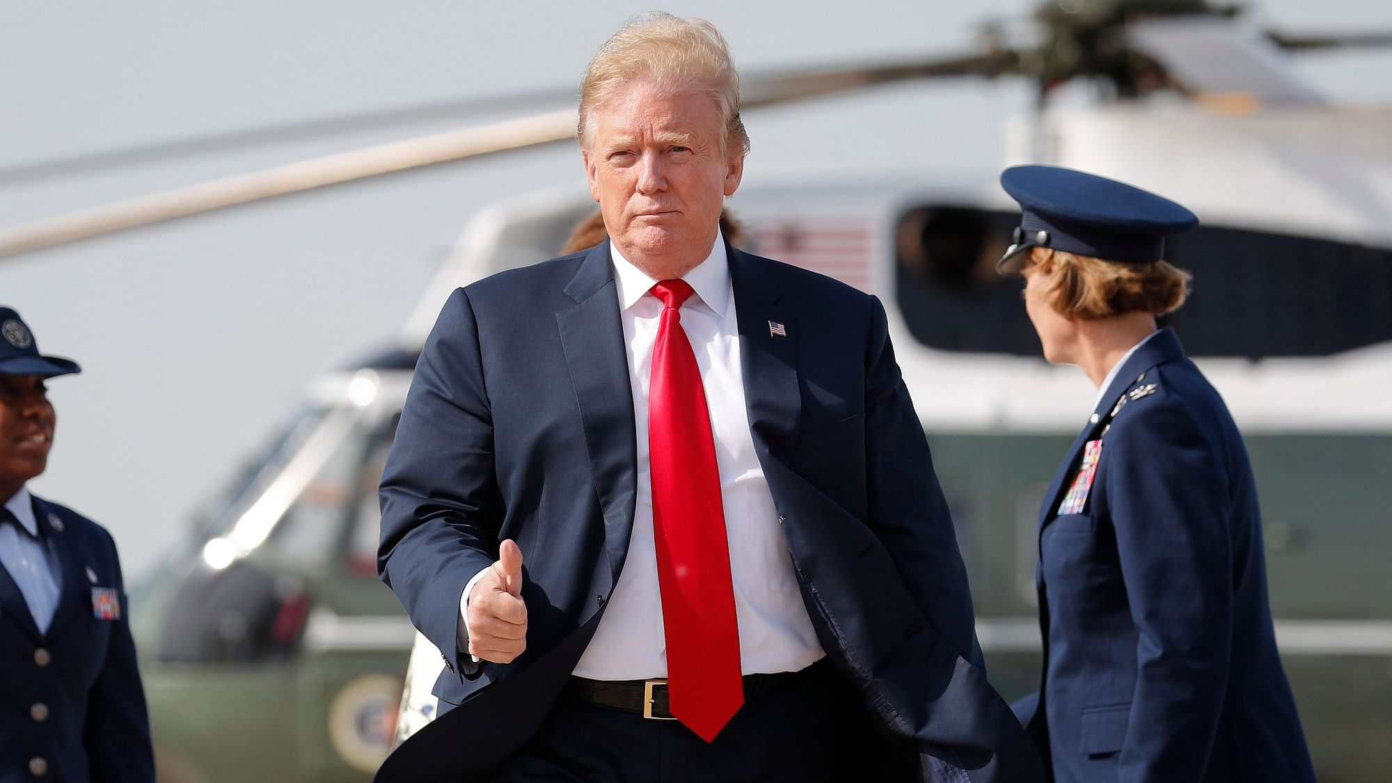 President Donald Trump gives a ‘thumbs-up’ as he prepares to board Air Force One, Thursday, 18 April, 2019, at Andrews Air Force Base.