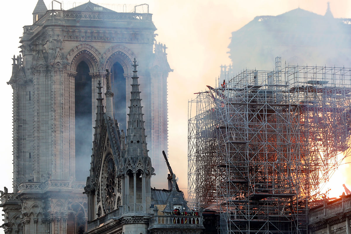 Emmanuel Macron has pledged to rebuild the 800-year-old cathedral and said that France will seek international help.