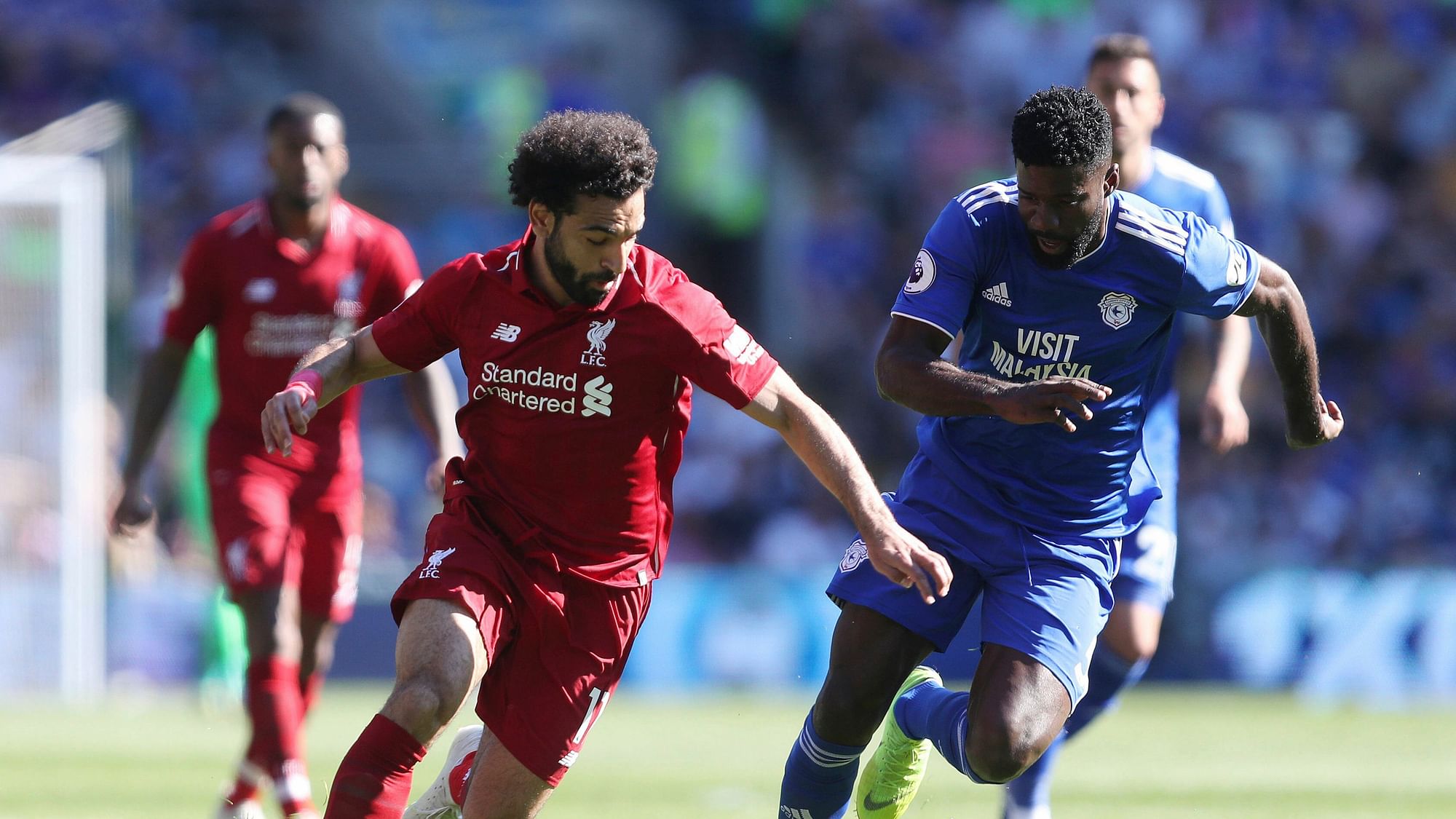 Liverpool returned to the top of the Premier League with a 2-0 victory at Cardiff on Sunday.