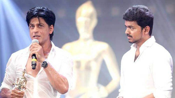 Shah Rukh Khan and Vijay at an awards event.