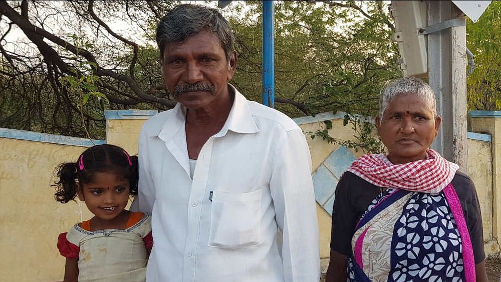 B Chennaiah, owner of a 14-acre farm in Yemmiganur mandal of Kurnool district in western Andhra Pradesh, with his wife Tayamma and their grandchildren, waiting for the Guntur-bound train at Tuggali station. Persistent drought in western Andhra Pradesh is forcing big and small farmers alike to give up agriculture and migrate to more prosperous regions in search of daily-wage work.