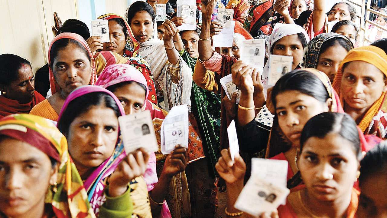Voters standing in a queue to vote.