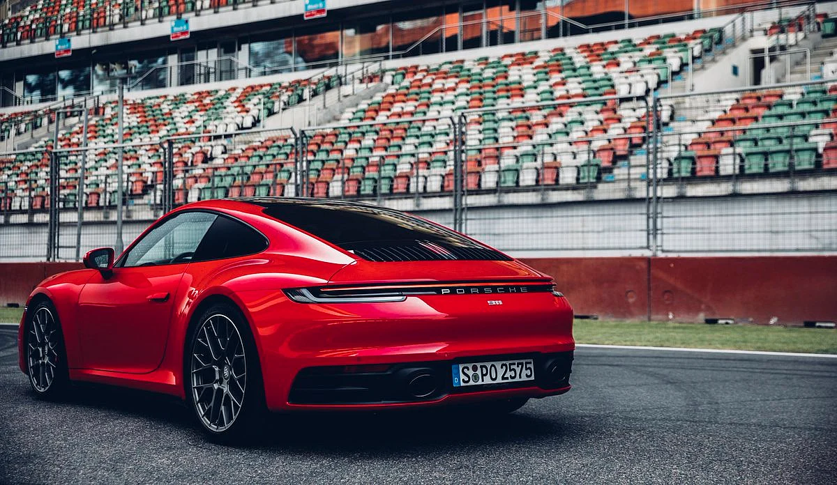 The tail-lamp stretches across the rear like the original design.