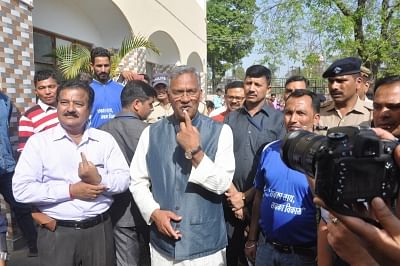 Uttarakhand Chief Minister Trivendra Singh Rawat showing his inked finger after casting his vote for Lok Sabha election in Dehradun on April 11, 2019. (Photo: IANS)