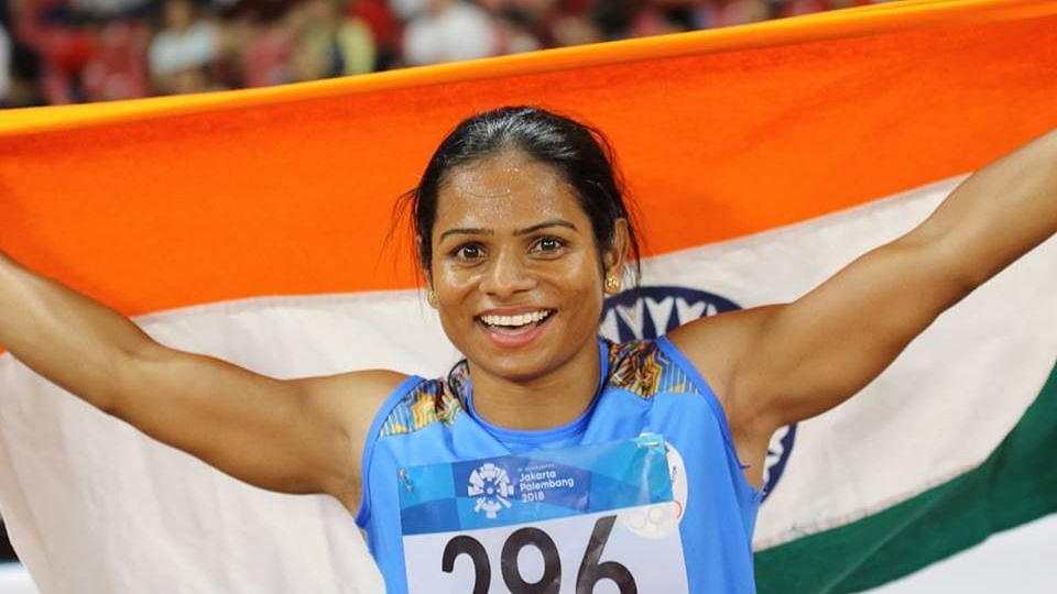 Dutee Chand celebrating after her record breaking sprint  at the 23rd Asian Athletics Championships in Doha.