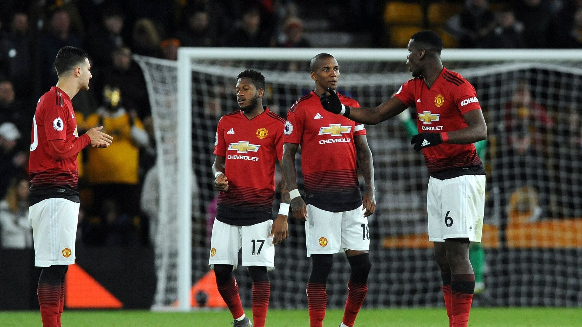 Manchester United’s Paul Pogba, right, talks to teammate Ashley Young during the English Premier League soccer match between Wolverhampton Wanderers and Manchester United at the Molineux Stadium in Wolverhampton, England, Tuesday, April 2, 2019.&nbsp;