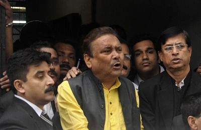 Kolkata: Trinamool leader Madan Mitra being taken to be produced at a Kolkata court in connection with the multi-crore rupee Saradha chit fund scam in Kolkata, on Dec 17, 2015. (Photo: IANS)