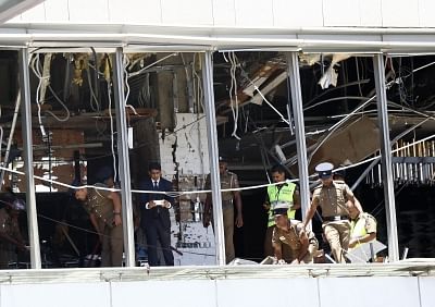 Colombo, April 22, 2019 (Xinhua) -- Police and investigators work at a blast scene at Shangri-La hotel in Colombo, Sri Lanka, April 21, 2019. The death toll from the multiple blasts that ripped through Sri Lanka on Sunday rose to 228 while 450 others were injured, local media quoting hospital sources said. (Xinhua/Wang Shen/IANS)