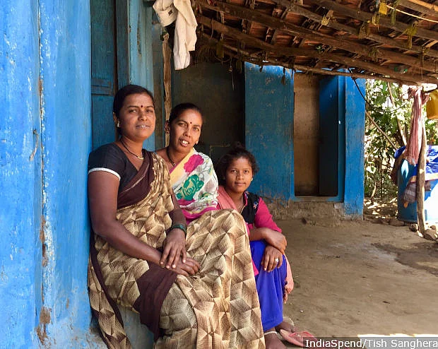 Bharti Chabilal, 32 (centre), with her neighbours sitting outside her home on a hot March afternoon, in Pimplad, a village in Nashik district in northwestern Maharashtra. While their husbands are able to migrate to nearby towns and cities in search of work, women like her have to stay behind due to the burden of household chores and a lack of education that reduces their chances of finding skilled jobs.