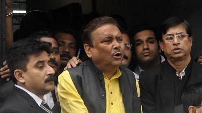 Kolkata: Trinamool leader Madan Mitra being taken to be produced at a Kolkata court in connection with the multi-crore rupee Saradha chit fund scam in Kolkata, on 17 December 2015.&nbsp; Image used for representation.